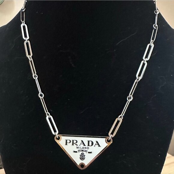 Prada charm with unbranded chain included